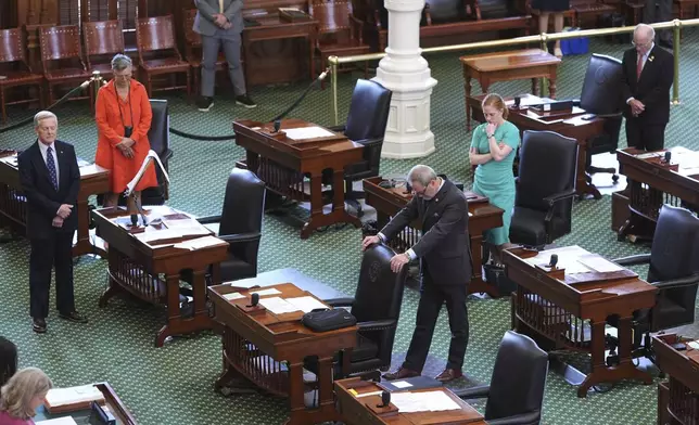 Texas state senators pray before they debate a bill on a redrawn U.S. congressional map during a special session in the Senate Chamber at the Texas Capitol in Austin, Texas, Friday, Aug. 22, 2025. (AP Photo/Eric Gay)