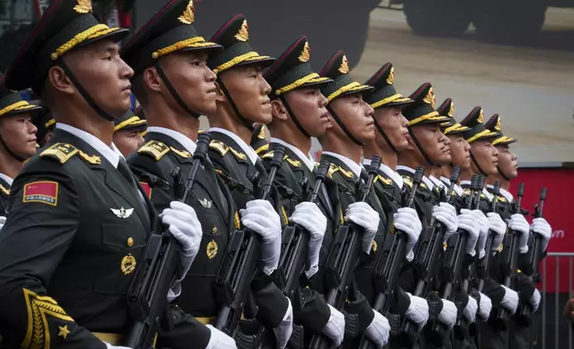 People's Liberation Army of China march during a military parade rehearsal for the Vietnam's 80th National Day celebration in Hanoi, Vietnam, Saturday, Aug. 30, 2025. (AP Photo/Vincent Thian)