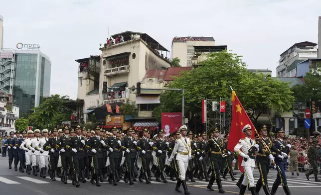 People's Liberation Army of China march during military parade rehearsal for the Vietnam's 80th National Day celebration in old town of Hanoi, Vietnam, Saturday, Aug. 30, 2025. (AP Photo/Vincent Thian)