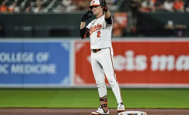 Baltimore Orioles' Gunnar Henderson celebrates after hitting a double during the fourth inning of a baseball game against the Seattle Mariners, Wednesday, Aug. 13, 2025, in Baltimore. (AP Photo/Stephanie Scarbrough)