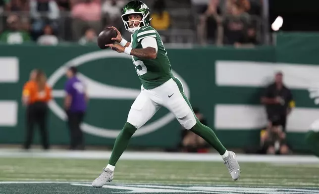 New York Jets quarterback Adrian Martinez (15) passes in the second half of a preseason NFL football game against the Philadelphia Eagles in East Rutherford, N.J., Friday, Aug. 22, 2025. (AP Photo/Yuki Iwamura)