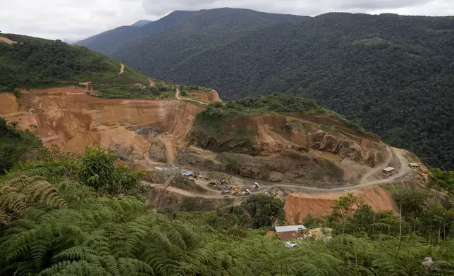 FILE - Heavy machinery used to mine gold dot an open pit on the outskirts of Santa Rosa, Bolivia, June 17, 2023. (AP Photo/Juan Karita, File)