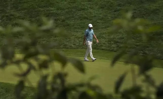 Scottie Scheffler walks across the third green during the final round of the BMW Championship golf tournament Sunday, Aug. 17, 2025, in Owings Mills, Md. (AP Photo/Stephanie Scarbrough)