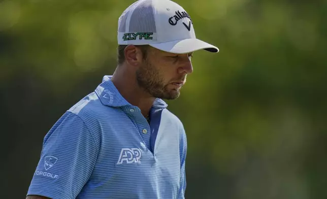 Sam Burns walks off the ninth tee during the final round of the BMW Championship golf tournament Sunday, Aug. 17, 2025, in Owings Mills, Md. (AP Photo/Stephanie Scarbrough)