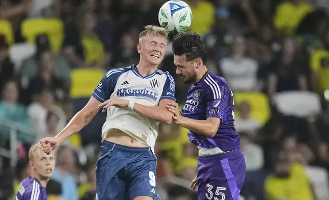 Nashville SC forward Sam Surridge (9) heads the ball over Orlando City midfielder Joran Gerbet (35) during the first half of an MLS soccer match Saturday, Aug. 23, 2025, in Nashville, Tenn. (AP Photo/George Walker IV)