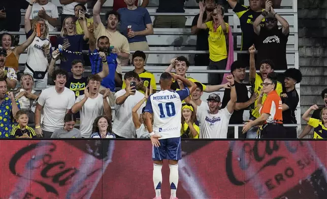 Nashville SC midfielder Hany Mukhtar (10) celebrates scoring a goal during the first half of an MLS soccer match against Orlando City, Saturday, Aug. 23, 2025, in Nashville, Tenn. (AP Photo/George Walker IV)
