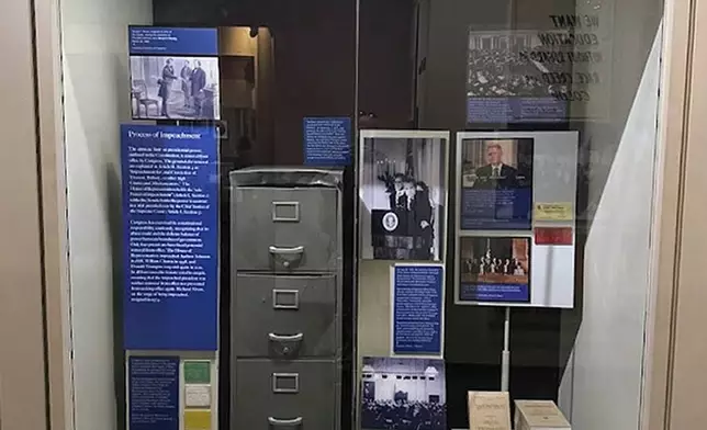An updated display at Smithsonian’s National Museum of American History traces the history of presidential impeachments, Aug. 26, 2025. References to President Donald Trump’s two impeachment trials were removed in July and restored in August with revisions that still describe his House impeachments and Senate acquittals on counts of inciting an insurrection, abusing power and obstructing Congress.” (AP Photo/Calvin Woodward)
