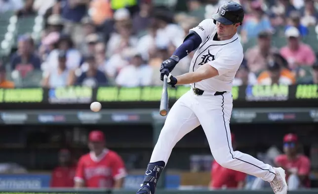 Detroit Tigers designated hitter Colt Keith hits a single during the fourth inning of a baseball game against the Los Angeles Angels, Sunday, Aug. 10, 2025, in Detroit. (AP Photo/Ryan Sun)