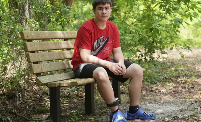 Cayden Gillespie sits on a bench at a local park Saturday, April 26, 2025, in Gainesville, Fla. Gillespie spent months in juvenile detention after pleading guilty to two felony charges. While in custody the state of Florida provided online learning instead of in person classes which students, parents and staff say has been disastrous. (AP Photo/Marta Lavandier)