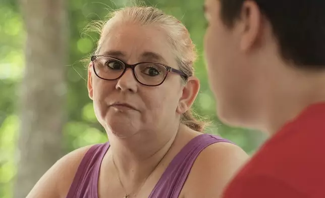 Robyn Gillespie listens to her son Cayden as he recalls his educational experience while in juvenile detention, April 26, 2025, in Gainesville, Fla. (AP Photo/Marta Lavandier)