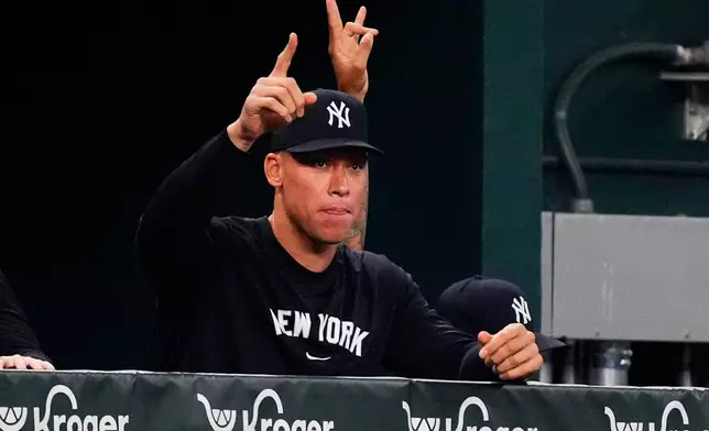 New York Yankees Aaron Judge gestures in the dugout during the second inning of a baseball game against the Texas Rangers, Monday, Aug. 4, 2025, in Arlington, Texas. (AP Photo/LM Otero)