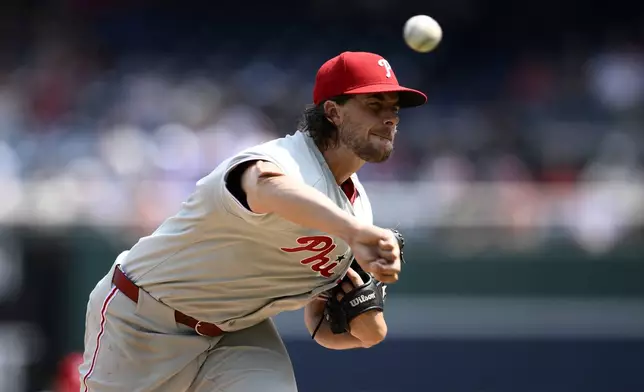 Philadelphia Phillies starting pitcher Aaron Nola throws during the first inning of a baseball game against the Washington Nationals, Sunday, Aug. 17, 2025, in Washington. (AP Photo/Nick Wass)