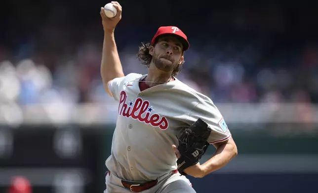 Philadelphia Phillies starting pitcher Aaron Nola throws during the first inning of a baseball game against the Washington Nationals, Sunday, Aug. 17, 2025, in Washington. (AP Photo/Nick Wass)