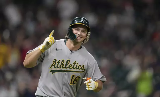 Athletics' Nick Kurtz celebrates after hitting a three-run home run, his fourth home run of the game, against the Houston Astros during the ninth inning of a baseball game Friday, July 25, 2025, in Houston. (AP Photo/David J. Phillip)