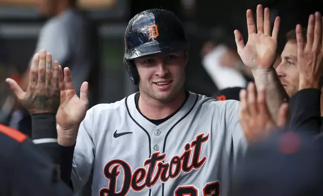 Detroit Tigers' Colt Keith celebrates after scoring on an error by Minnesota Twins second baseman Luke Keaschall (15) during the first inning of a baseball game Friday, Aug. 15, 2025, in Minneapolis. (AP Photo/Matt Krohn)