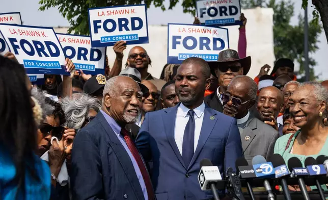 Flanked by supporters, U.S. Democratic Rep. Danny Davis, left, endorses state Rep. La Shawn Ford as his replacement after his retirement announcement during a news conference outside his 7th Congressional District office on the West Side of Chicago, Thursday, July 31, 2025. (Ashlee Rezin/Chicago Sun-Times via AP)