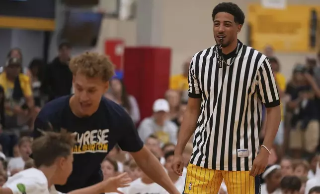 Indiana Pacers' Tyrese Haliburton watches a scrimmage during his basketball camp at the Indiana Pacers Athletic Center, Saturday, Aug. 23, 2025, in Westfield, Ind. (AP Photo/Darron Cummings)