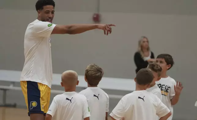 Indiana Pacers' Tyrese Haliburton talks to participants during his basketball camp at the Indiana Pacers Athletic Center, Saturday, Aug. 23, 2025, in Westfield, Ind. (AP Photo/Darron Cummings)