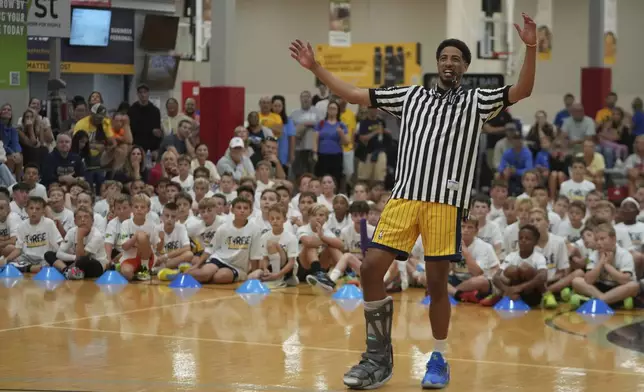 Indiana Pacers' Tyrese Haliburton watches a scrimmage during his basketball camp at the Indiana Pacers Athletic Center, Saturday, Aug. 23, 2025, in Westfield, Ind. (AP Photo/Darron Cummings)