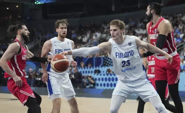 Finland's Lauri Markkanen catches a ball during the Eurobasket, European Basketball Championship quarter final match between Finland and Georgia at the Riga Arena in Riga, Latvia, Wednesday, Sept. 10, 2025. (AP Photo/Sergei Grits)