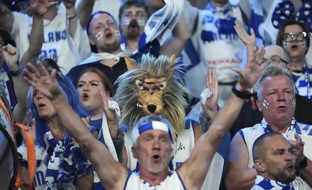 Finland fans cheer their team ahead of the Eurobasket, European Basketball Championship quarter final match between Finland and Georgia at the Riga Arena in Riga, Latvia, Wednesday, Sept. 10, 2025. (AP Photo/Sergei Grits)
