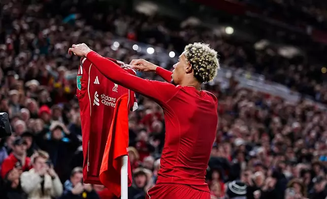 Liverpool's Hugo Ekitike celebrates after scoring his side's second goal during the English League Cup third round soccer match between Liverpool and Southampton at the Anfield stadium in Liverpool, England, Tuesday, Sept. 23, 2025. (Peter Byrne/PA via AP)