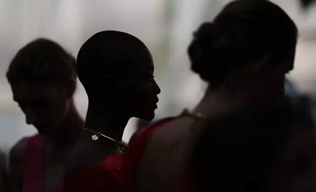Models wear designs by Silvia Tcherassi backstage before the brand's show at Fashion Week in Madrid, Spain, Wednesday, Sept. 17, 2025. (AP Photo/Manu Fernandez)