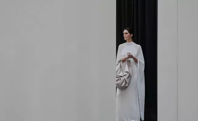 A model wears a design by Silvia Tcherassi backstage before the brand's show at Fashion Week in Madrid, Spain, Wednesday, Sept. 17, 2025. (AP Photo/Manu Fernandez)