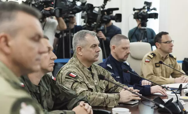 Gen. Wieslaw Kukula, center, chief of the General Staff of the Polish Armed Forces, sits during an extraordinary government meeting, in Warsaw, Poland, Wednesday, Sept. 10, 2025, following violations of Polish airspace by Russian drones. (Chancellery of the Prime Minister of Poland via AP)