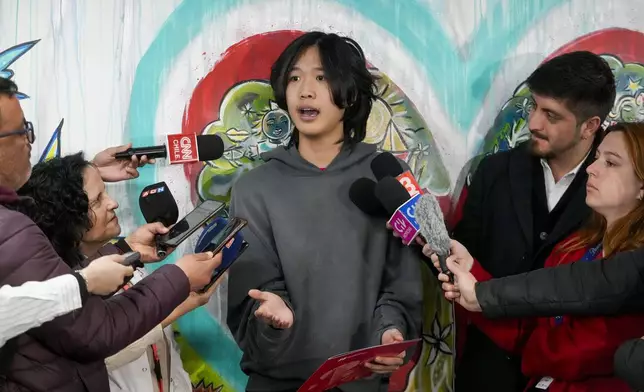 U.S. influencer Ethan Guo speaks with journalists at an event about his donation to children's cancer rehabilitation programs, at the "Fundacion Nuestros Hijos" headquarters in Santiago, Chile, Tuesday, Sept. 9, 2025. (AP Photo/Esteban Felix)