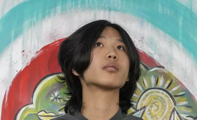 U.S. influencer Ethan Guo waits for the start of an event about his donation to children's cancer rehabilitation programs, at the "Fundacion Nuestros Hijos" headquarters in Santiago, Chile, Tuesday, Sept. 9, 2025. (AP Photo/Esteban Felix)