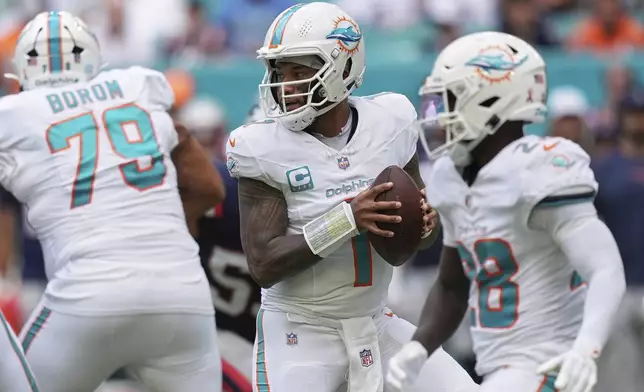 Miami Dolphins' Tua Tagovailoa drops back during the half of an NFL football game against the New England Patriots Sunday, Sept. 14, 2025, in Miami Gardens, Fla. (AP Photo/Rebecca Blackwell)