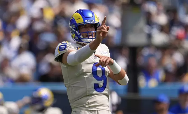 Los Angeles Rams quarterback Matthew Stafford gestures during the first half of an NFL football game against the Tennessee Titans, Sunday, Sept. 14, 2025, in Nashville, Tenn. (AP Photo/George Walker IV)