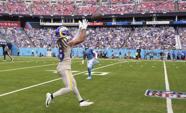Los Angeles Rams wide receiver Jordan Whittington, left, makes a catch as Tennessee Titans safety Amani Hooker defends during the second half of an NFL football game Sunday, Sept. 14, 2025, in Nashville, Tenn. (AP Photo/George Walker IV)