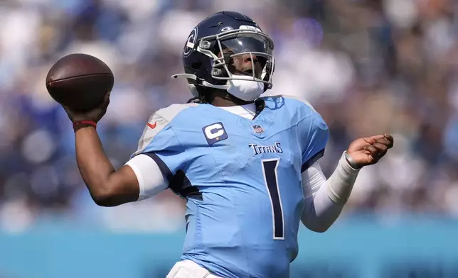 Tennessee Titans quarterback Cam Ward throws a touchdown pass during the first half of an NFL football game against the Los Angeles Rams, Sunday, Sept. 14, 2025, in Nashville, Tenn. (AP Photo/George Walker IV)