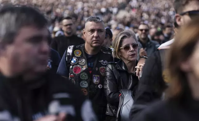 Motorcyclists attend mass at the Roman Catholic holy shrine of Fatima, during the 10th Pilgrimage of the Blessing of Helmets that draws tens of thousands, in Fatima, Portugal, Sunday, Sept. 21, 2025. (AP Photo/Ana Brigida)