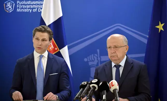 EU Commissioner for Defence and Space, Lithuanian Andrius Kubilius, right and Finnish Defence Minister Antti Hakkanen take part in a press conference, at the Ministry of Defence in Helsinki, Finland, Friday, Sept. 26, 2025. (Markku Ulander /Lehtikuva via AP)