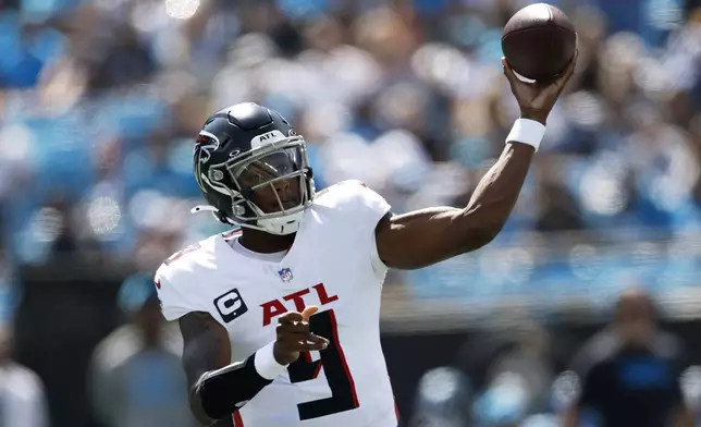 Atlanta Falcons quarterback Michael Penix Jr. passes against the Carolina Panthers during the first half of an NFL football game, Sunday, Sept. 21, 2025, in Charlotte, N.C. (AP Photo/Rusty Jones)