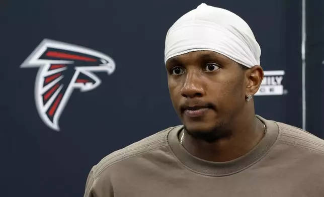 Atlanta Falcons quarterback Michael Penix Jr. speaks during a news conference after an NFL football game against the Carolina Panthers, Sunday, Sept. 21, 2025, in Charlotte, N.C. (AP Photo/Rusty Jones)