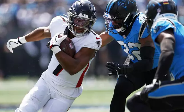 Atlanta Falcons running back Bijan Robinson runs against the Carolina Panthers during the first half of an NFL football game, Sunday, Sept. 21, 2025, in Charlotte, N.C. (AP Photo/Rusty Jones)