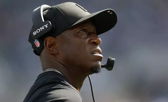 Atlanta Falcons head coach Raheem Morris watches during the second half of an NFL football game against the Carolina Panthers, Sunday, Sept. 21, 2025, in Charlotte, N.C. (AP Photo/Rusty Jones)