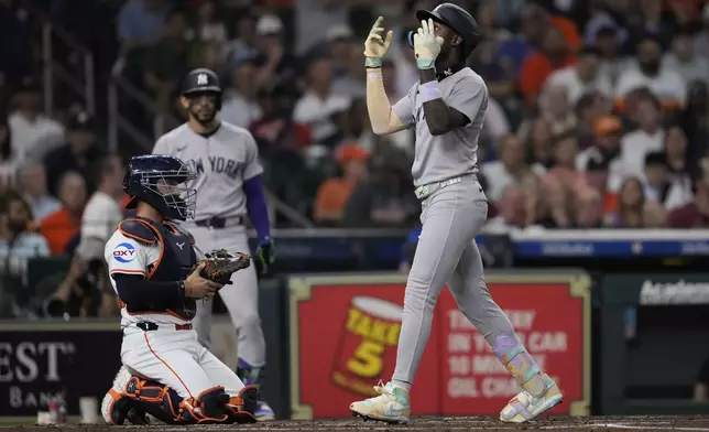 New York Yankees' Jazz Chisholm Jr., right, celebrates after hitting a home run during the second inning of a baseball against the Houston Astrosgame in Houston, Tuesday, Sept. 2, 2025. Trent Grisham also scored. (AP Photo/Ashley Landis)