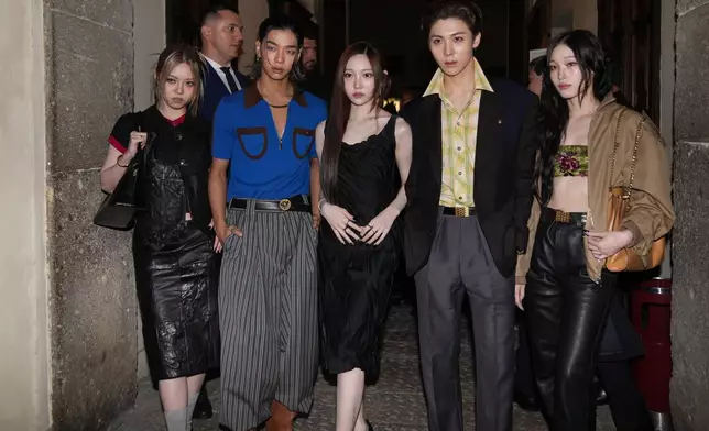 CORRECTS ALLAY TO ALLDAY - Members of the AllDay Project, ADP, a South Korean group, from left, Bailey, Tarzzan, Youngseo, Woo-chan and Annie arrive for the Versace Intimate fashion event in Milan, Friday, Sept. 26, 2025. (AP Photo/Antonio Calanni)