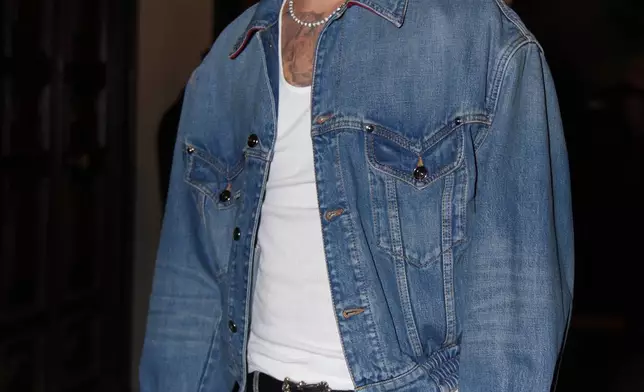Romeo Beckham arrives for the Versace Intimate fashion event, in Milan, Friday, Sept. 26, 2025. (AP Photo/Antonio Calanni)