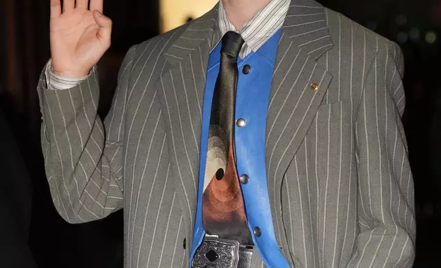 Chinese actor Ding Yuxi arrives for the Versace Intimate fashion event, in Milan, Friday, Sept. 26, 2025. (AP Photo/Antonio Calanni)