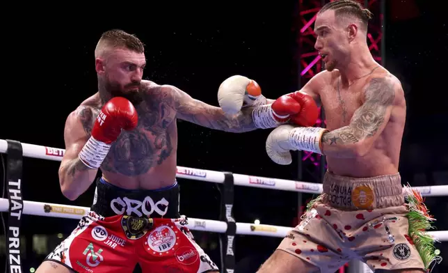 Lewis Crocker, left, and Paddy Donovan battle during an IBF world welterweight bout at the SSE Arena, Saturday, Sept. 13, 2025, in Belfast, Northern Ireland. (Peter Morrison/PA via AP)