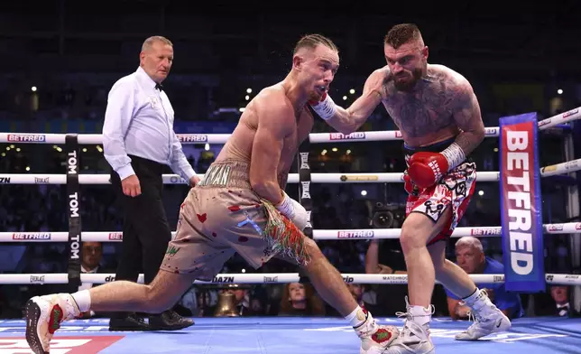 Lewis Crocker, right, punches Paddy Donovan battle during an IBF world welterweight bout at the SSE Arena, Saturday, Sept. 13, 2025, in Belfast, Northern Ireland. (Peter Morrison/PA via AP)