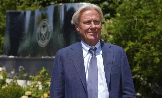 FILE - Tennis great Bjorn Borg poses for a photo as he arrives for Day 11 at the Wimbledon Tennis Championships in London, July 10, 2025. (AP Photo/Joanna Chan, File)