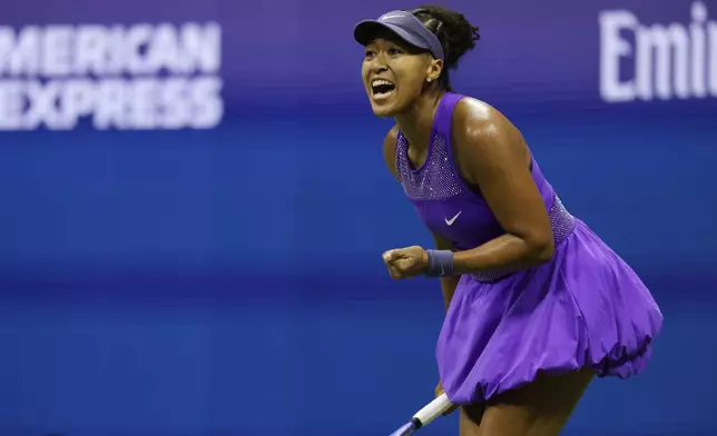 Naomi Osaka, of Japan, reacts during a match against Karolina Muchova, of the Czech Republic, at the quarterfinal round of the U.S. Open tennis championships, Wednesday, Sept. 3, 2025, in New York. (AP Photo/Adam Hunger)