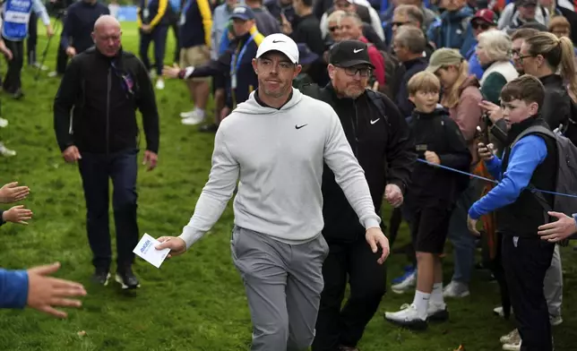 Rory McIlroy walks the course between fans during the Irish Open golf tournament, Thursday, Sept. 4, 2025, at The K Club in Staffan, Ireland. (Brian Lawless/PA via AP)